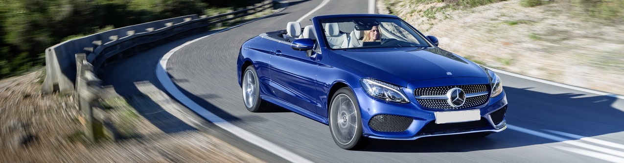 blue Mercedes Benz on a road travelling for service and repair